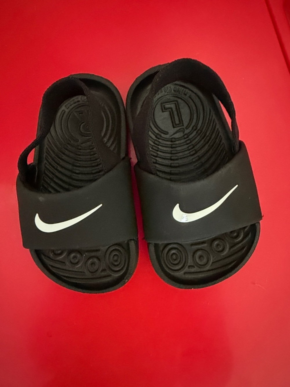 Nike Kids Black Slide Sandals with White Swoosh Accent
